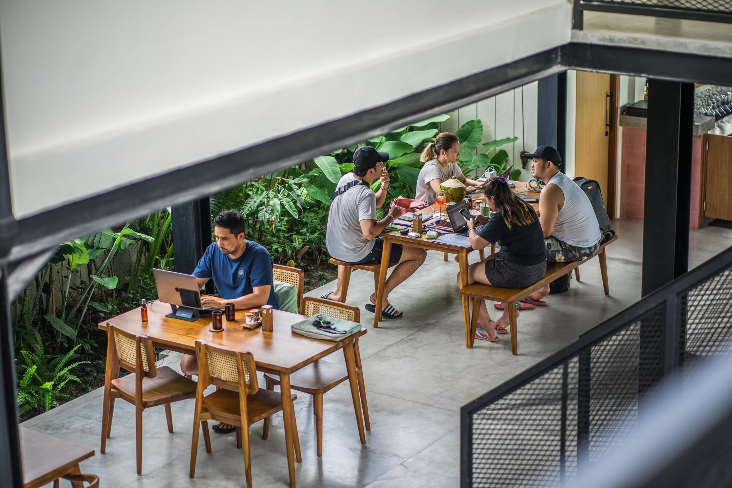 people working at a digital nomad hostel