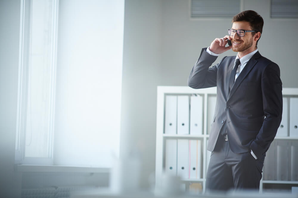 Businessman talking on the phone with a internationally roaming 