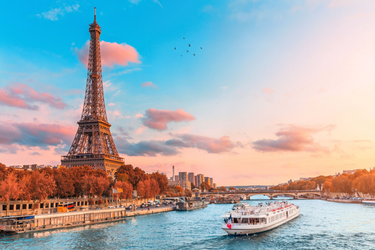Eiffel Tower in Paris, sunset and river.